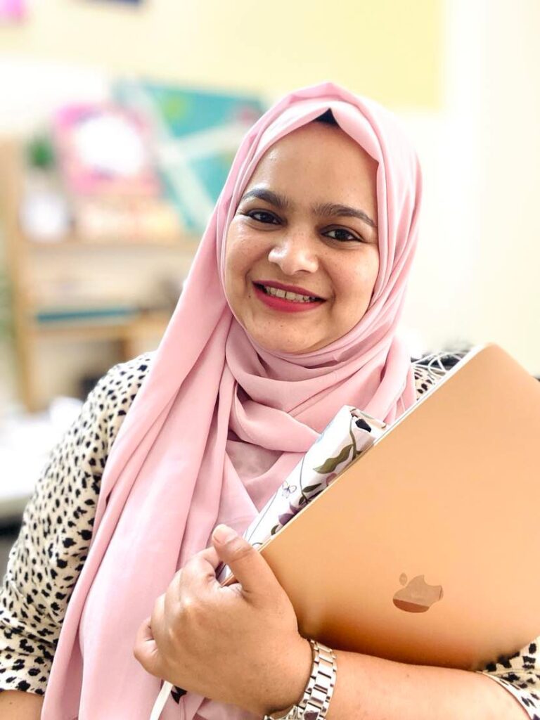 this is a picture of dr asbah shams, md, who's a high performance and productivity coach for muslimah entrepreneurs & purpose-driven women